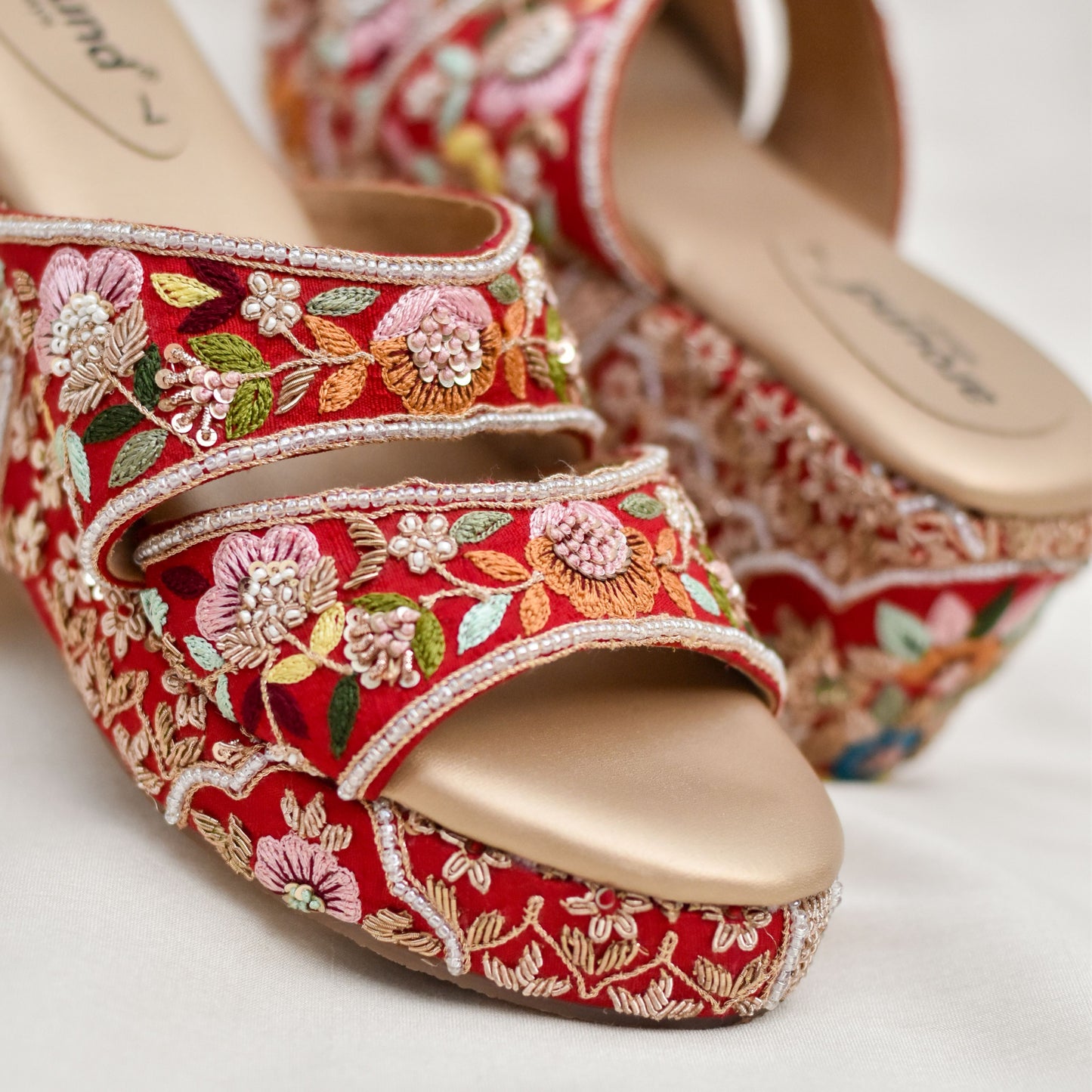 Hand embroidered wedding wedges with floral motifs