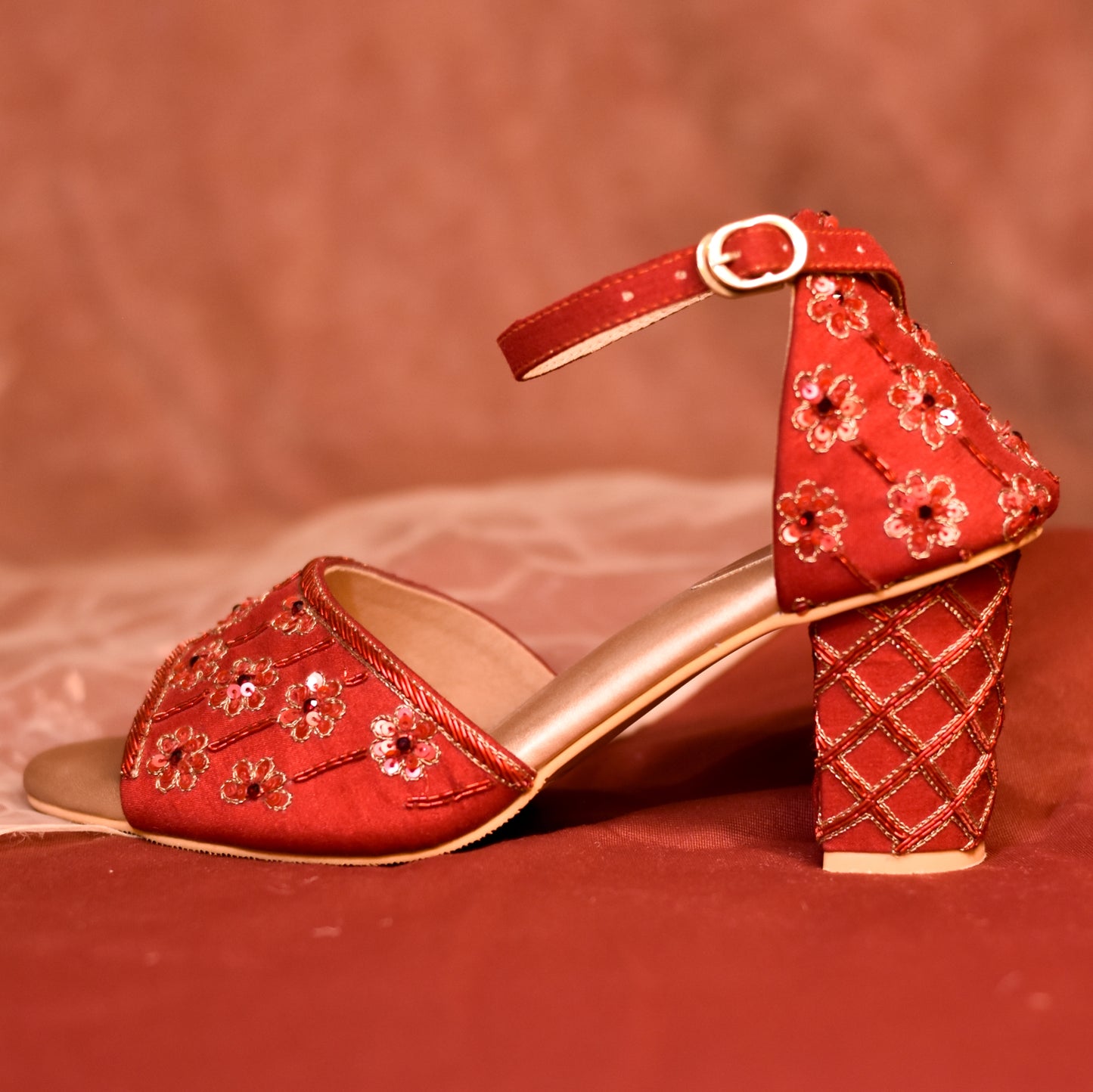 Red embroidered sandals in high block heels