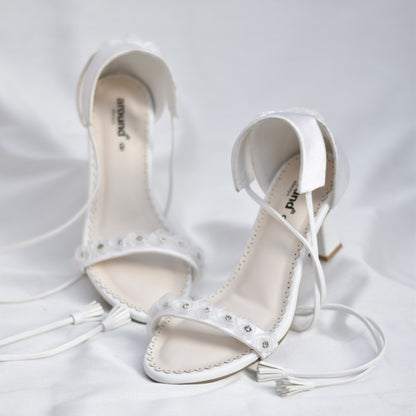 Supremely comfortable white lace up sandals for brides